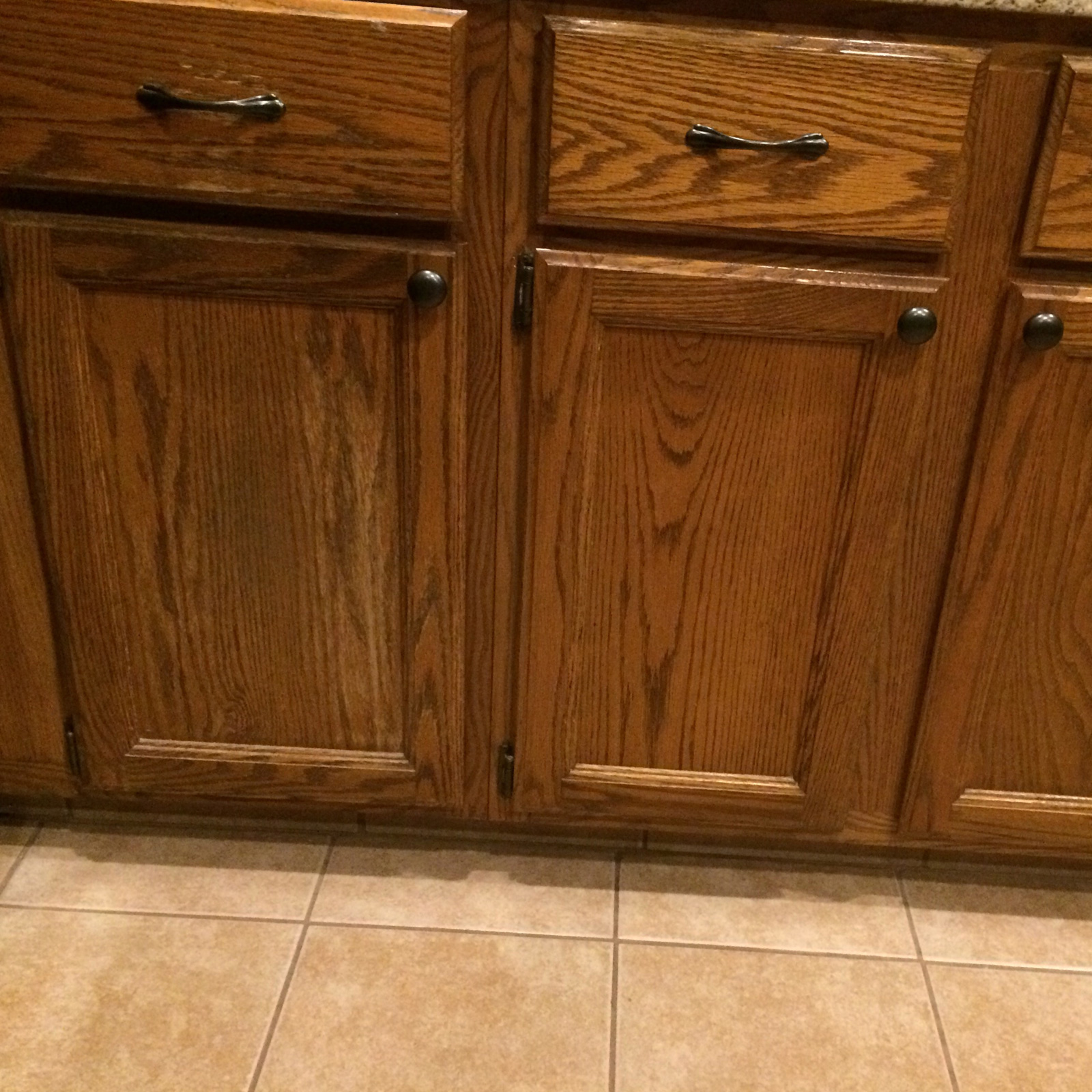 Entry 34 - Out of style & dated cabinetry makes for one tired kitchen!